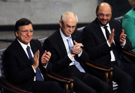 EU representatives President of the European Commission Barroso, President of the European Council Van Rompuy and President of the European Parliament Schulz applaud during the ceremony for the Nobel Peace Prize which they accepted on behalf of the E