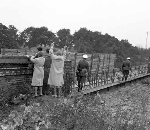 Families wave at their relatives across Berlin Wall