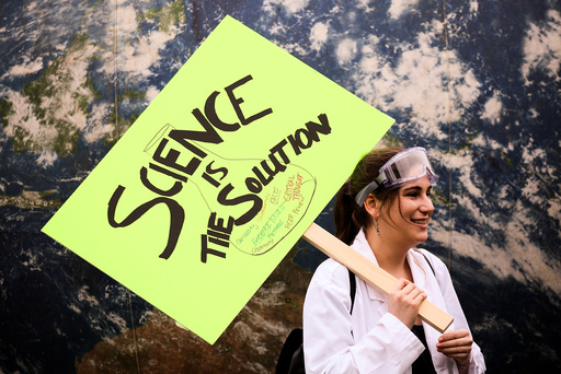 A protestor holds a sign in support of science during the March For Science in Seattle, Washington