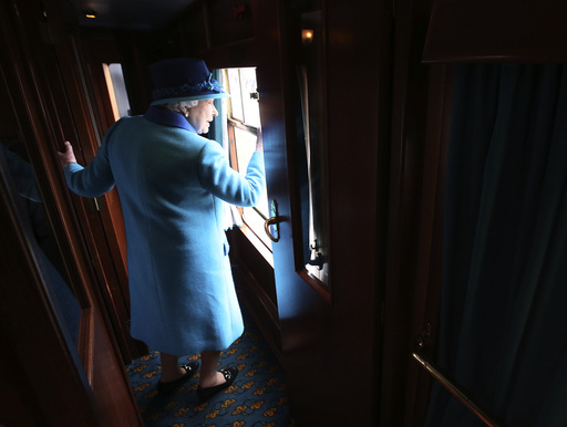Britain's Queen Elizabeth boards her carriage as she travels on the new Scottish Borders railway line, in Scotland