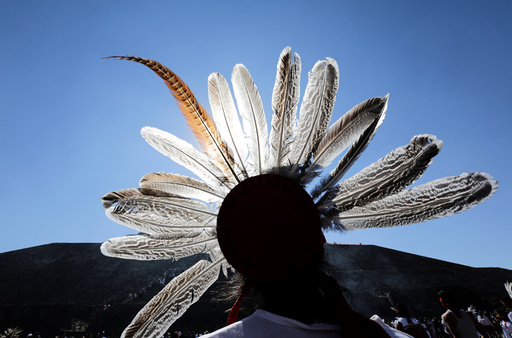 A dancer takes part in a ceremony to welcome the spring equinox in front the Pyramid of the Sun in the pre-hispanic city of Teotihuacan, on the outskirts of Mexico City