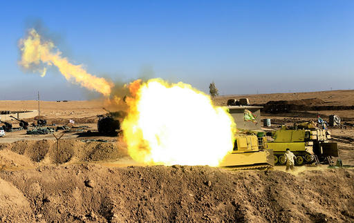 Iraqi army fires towards Islamic State militant positions in Mosul from the village of Adhbah