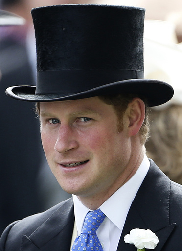 Britain's Prince Harry stands in the parade ring before The Gold Cup on the third day of the Royal Ascot horse racing festival at Ascot, southern England