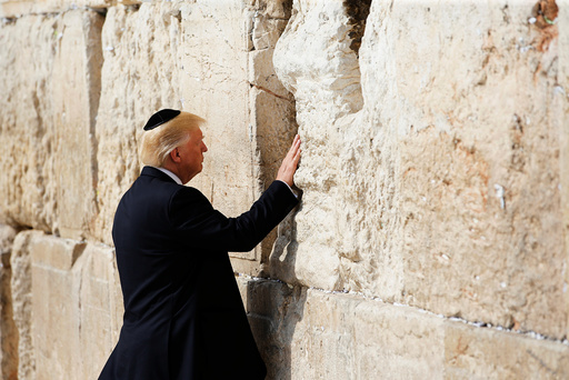 U.S. President Donald Trump touches the Western Wall, Judaism's holiest prayer site, in Jerusalem's Old City