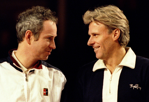 MCENROE AND BORG SHARE A MOMENT BEFORE THEIR MATCH