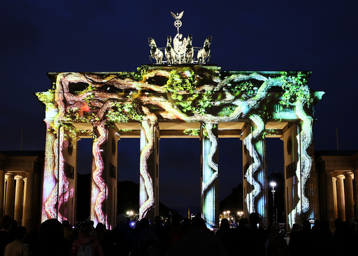 The Brandenburg Gate is illuminated during the Festival of Lights show in Berlin