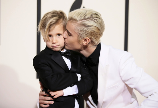 Singer Justin Bieber and his brother, Jaxon, arrive at the 58th Grammy Awards in Los Angeles