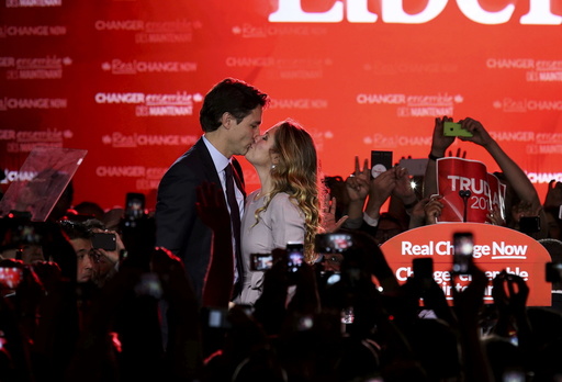 Liberal Party leader Justin Trudeau kisses his wife Sophie Gregoire as he arrives to give his victory speech after Canada's federal election in Montreal