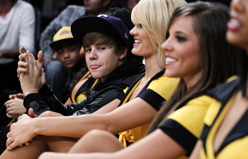 Justin Bieber sits amongst the Laker girls during the NBA basketball game between the Lakers and the Rockets in Los Angeles