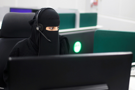 A Saudi woman works inside the first all-female call centre in the kingdom's security sector, in the holy city of Mecca