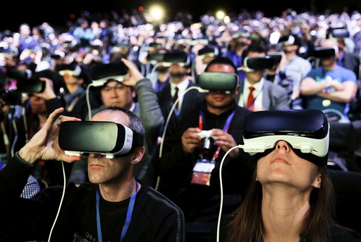 People wear Samsung Gear VR devices as they attend the launching ceremony of new Samsung S7 and S7 edge smartphones during the Mobile World Congress in Barcelona