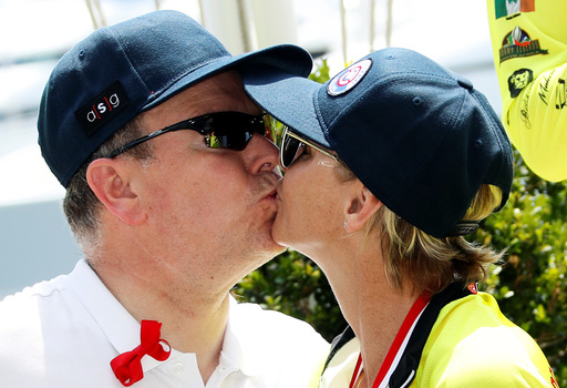 Prince Albert II of Monaco kisses his wife Princess Charlene after she won with her team the Riviera Water Bike Challenge in support of the Princess Charlene foundation in Monaco