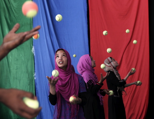 Girls, who are part of Afghan Mobile Mini Circus for Children (MMCC), participate in a juggling competition in Kabul