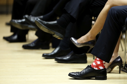 Canada's PM Trudeau wears maple leaf-themed socks during the First Ministers' meeting in Ottawa