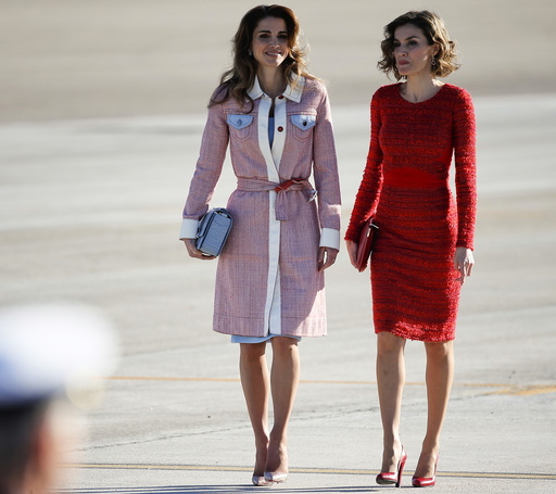 Spain's Queen Letizia walks with Jordan's Queen Rania during a welcoming ceremony at the start of a two-day official visit to Spain in Madrid