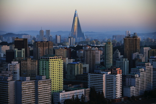 The 105-storey Ryugyong Hotel, the highest building under construction in North Korea, is seen behind residential buildings in Pyongyang