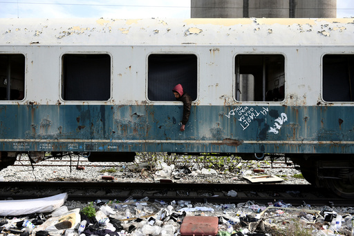 The Wider Image: Migrants ride railroads to seek better future