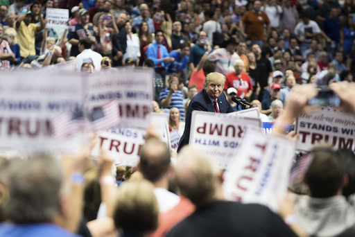 Donald Trump, a Republican presidential hopeful, speaks during a rally at the American Airlines Center in Dallas.