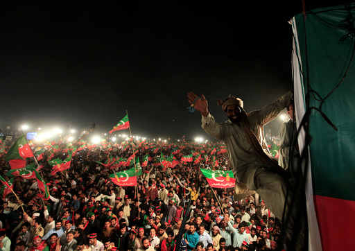 Supporters of opposition politician Imran Khan cheer at a celebration rally in Islamabad