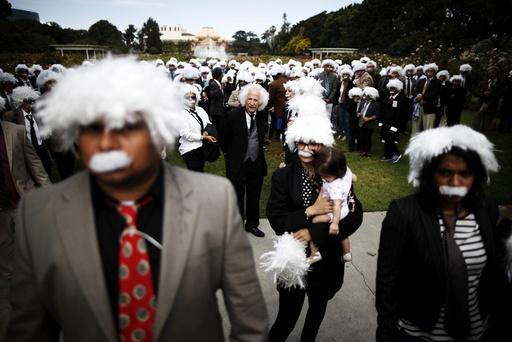 Benny Wasserman stands with others dressed as Albert Einstein as they gather to establish a Guinness world record for the largest Einstein gathering, to raise money for School on Wheels and homeless children's education, in Los Angeles