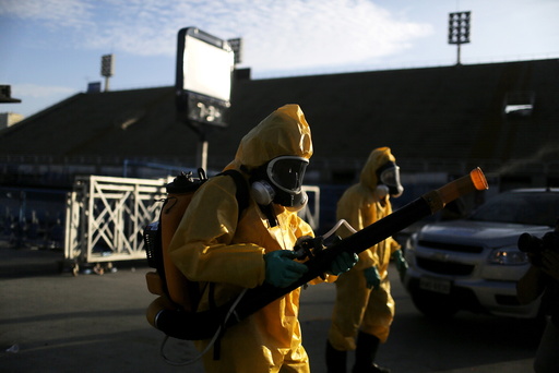 Municipal workers spray insecticide at Sambodrome in Rio de Janeiro