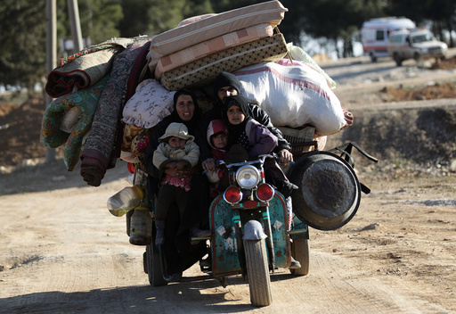 People who fled the violence from Islamic State-controlled northern Syrian town of al-Bab arrive in the rebel-held outskirts of the town