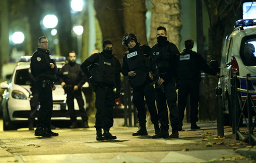 French special police forces secure the area during an operation to catch Paris attack fugitives in Saint-Denis