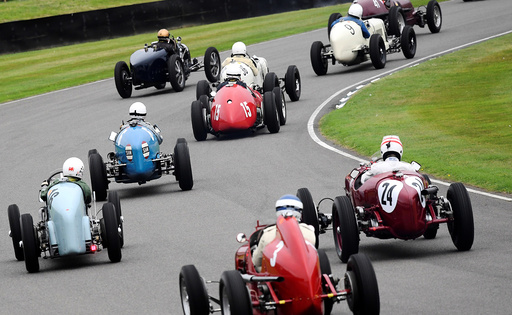 Cars race at the annual Goodwood Revival historic motor racing festival, celebrating a mid-twentieth century heyday of the racing circuit, near Chichester in south England