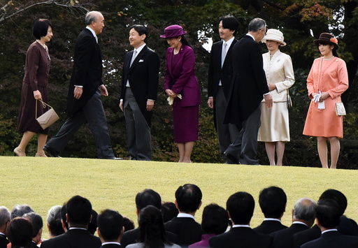 Japan's Crown Prince Naruhito and Crown Princess Masako greet guests with Prince Akishino, Princess Kiko and their daughter Princess Mako, during the annual autumn garden party hosted by Emperor Akihito and Empress Michiko in Tokyo