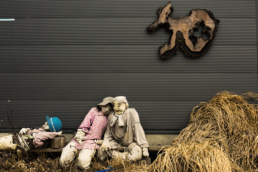 Scarecrows sit in front of a shed in the mountain village of Nagoro