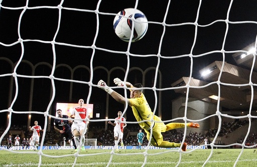 Paris St Germain's Lavezzi shoots and scores the third goal for the team during their Ligue 1 soccer match against Monaco at Louis II stadium in Monaco