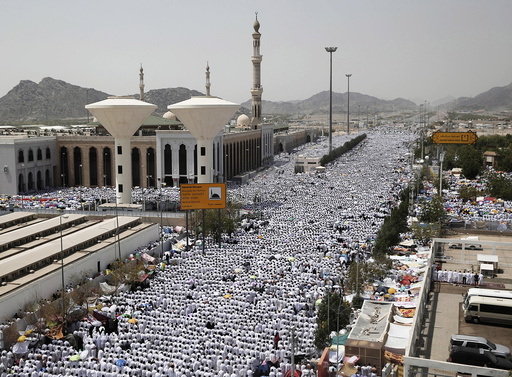Muslim pilgrims perform prayers in Arafat during the annual haj pilgrimage, outside the holy city of Mecca