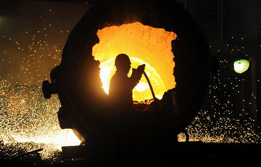 File photo of a worker operating a furnace at a steel plant in Hefei
