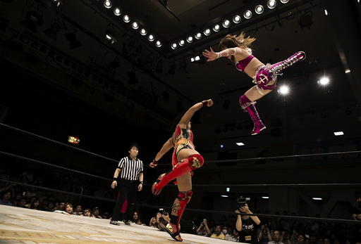 The Wider Image: Japan's women wrestlers fight to win