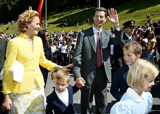 Hereditary Prince Alois von und zu Liechtenstein and his family wave to the people on their way to Vaduz castle