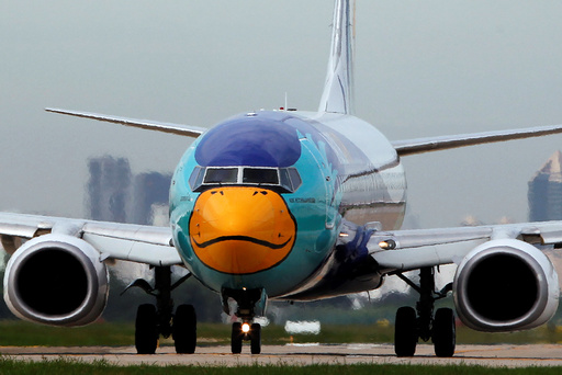 A Nok Air aircraft painted like a duck prepares to take off at Don Mueang International Airport in Bangkok, Thailand