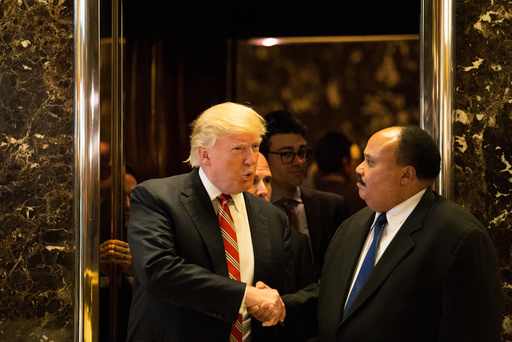 U.S. President-elect Donald Trump shakes hands with Martin Luther King III, an American human rights advocate, at Trump Tower in Manhattan