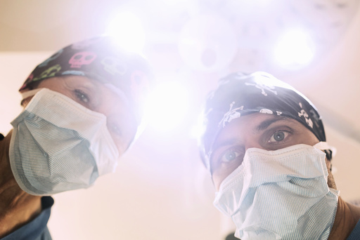 Low angle portrait of orthopedic surgeons in operating room