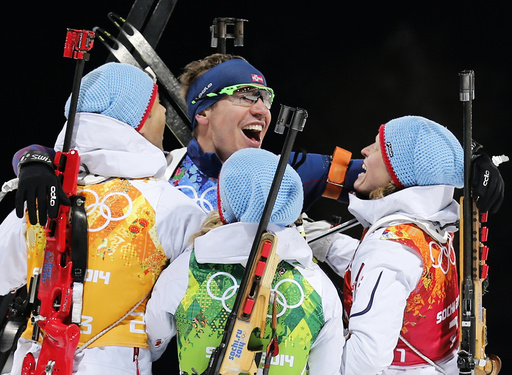 Norway's BjoerndalenSvendsen Eckhoff and Berger celebrate winning mixed biathlon relay at 2014 Sochi Olympic Games