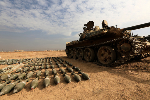 A captured Islamic State tank and shells are seen at the Iraqi army base in Qaraqosh, east of Mosul, Iraq