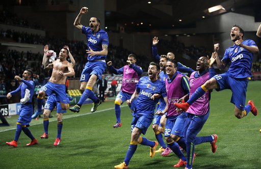Juventus players celebrate after their team's qualification for the semi-final of the Champions League at the end of their quarter-final second leg soccer match against Monaco at the Louis II stadium in Monaco