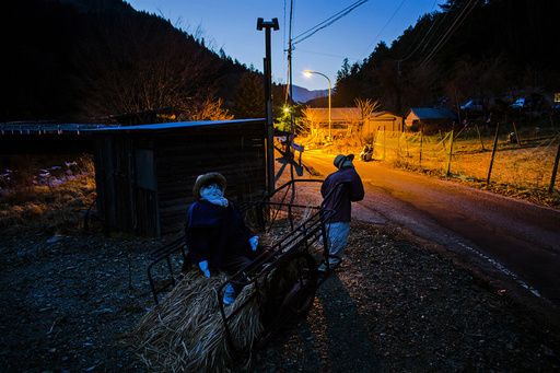 Scarecrows are seen at sunset in Nagoro