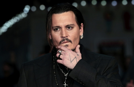 Actor Johnny Depp arrives for the British premiere of the film 
