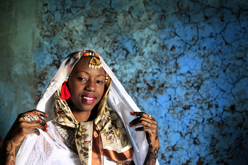 Kenyan bride Hawa Abdulkadir poses for a photograph during her traditional Nubian wedding ceremony in Nairobi's Kibera Slum