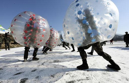 Soldiers engage in a bubble battle during annual ice fishing festival in Inje
