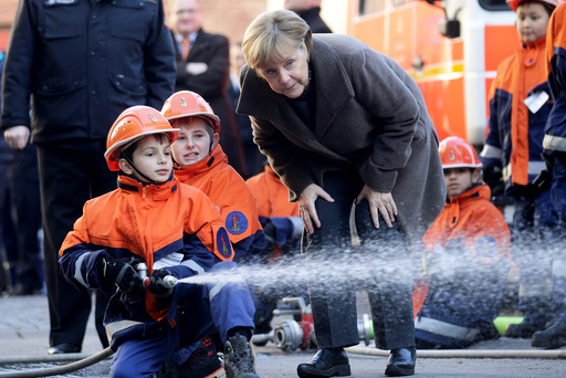 German Chancellor Merkel visits a youth fire brigade at Wedding in Berlin