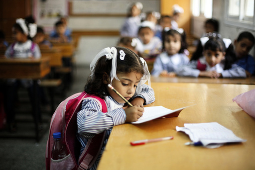 Palestinian schoolchildren attend a class at a U.N.-run school in Dir al-Balah in the central Gaza Strip, on the first day of the school year