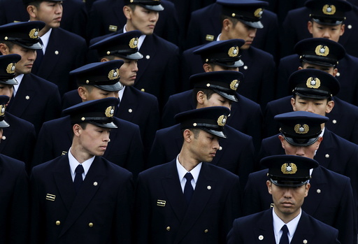 Members of the Tokyo fire department march during a New Year performance in Tokyo, Japan