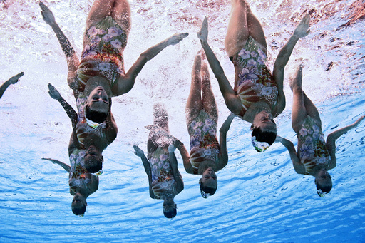Members of Team Italy are seen underwater as they perform in the synchronised swimming team free routine preliminary at the Aquatics World Championships in Kazan