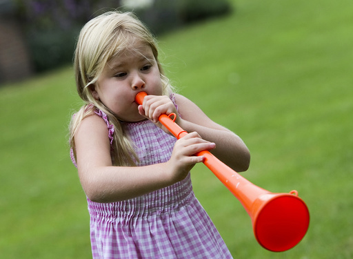 Princess Catharina-Amalia, daughter of Netherlands' Crown Prince Willem Alexander and Princess Maxima, blows an orange vuvuzela in Wassenaar